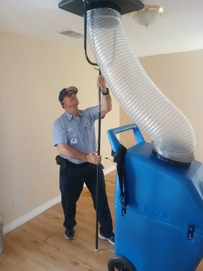 Furnace Tune-Up technician using HEPA equipment in Menlo Park